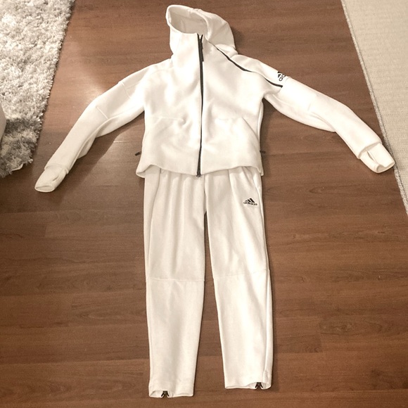 White sporty suit of the brand Adidas. It’s an X-small. Never wear and new. - Picture 1 of 3
